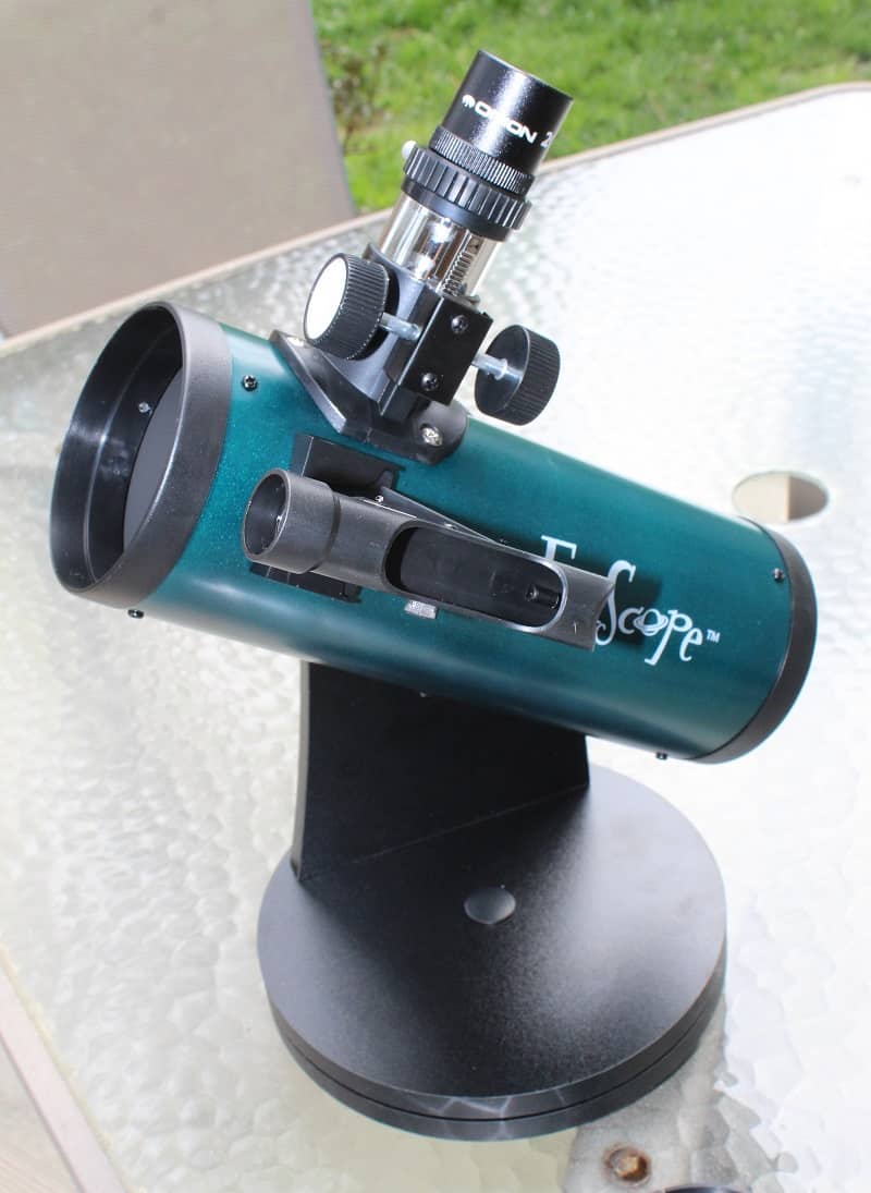 Orion FunScope 76mm telescope for kids sitting on patio tabletop