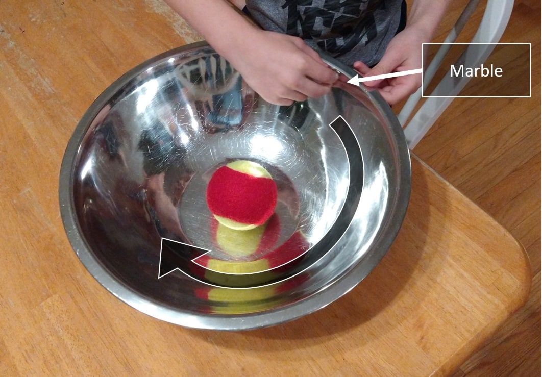 space activity for kids - orbit simulation using tennis ball and marble