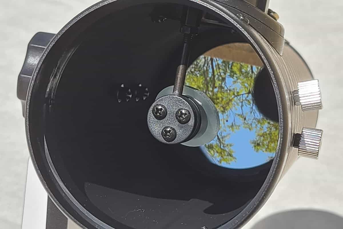 reflection in the primary mirror of a newtonian reflector telescope