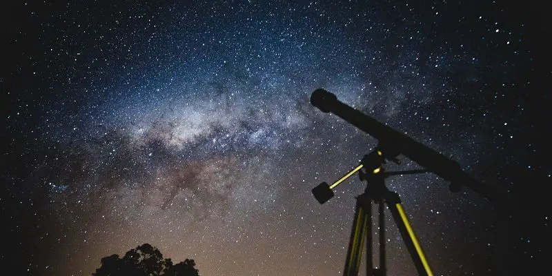 Telescope against a dark sky