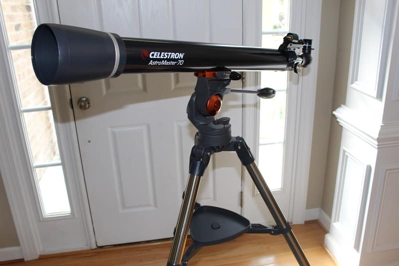 Celestron AstroMaster 70AZ telescope on tripod - side view