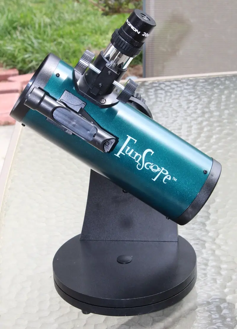 Orion FunScope 76mm telescope for kids - sitting on tabletop outdoors