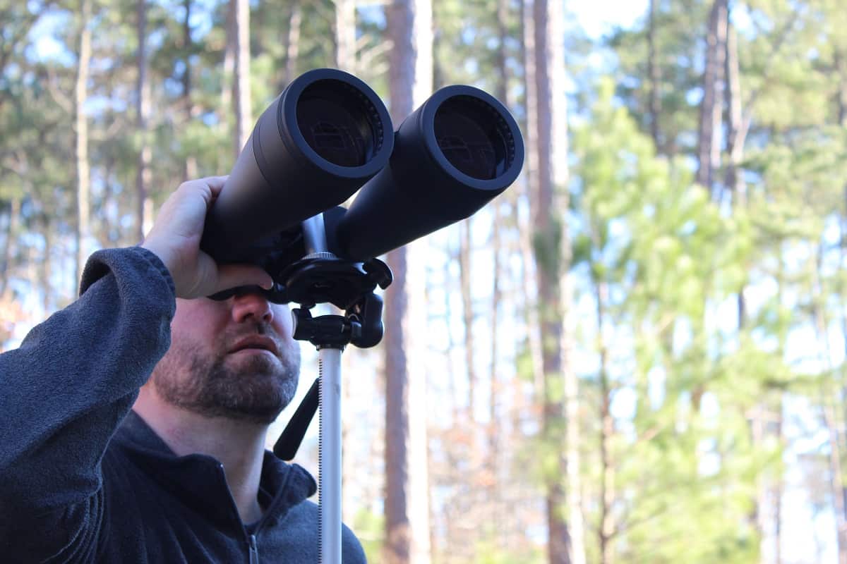 celestron skymaster 20x80 binoculars - man looking through binoculars