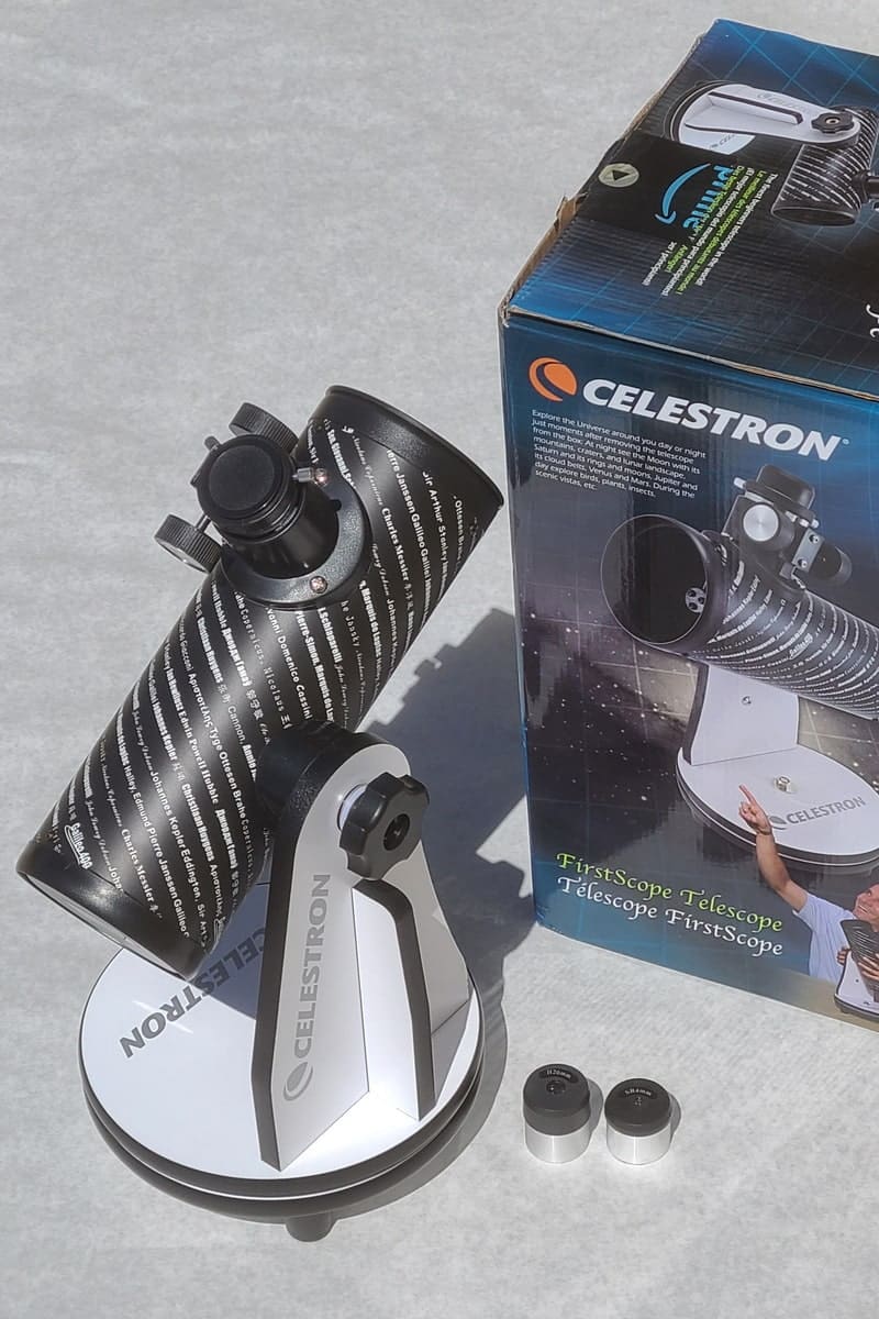 celestron firstscope 76mm telescope, packaging, and eyepieces
